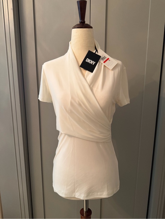 Dkny Tops - NWT DKNY White faux Wrap-Style Short Sleeve Blouse
Stretchy fabric